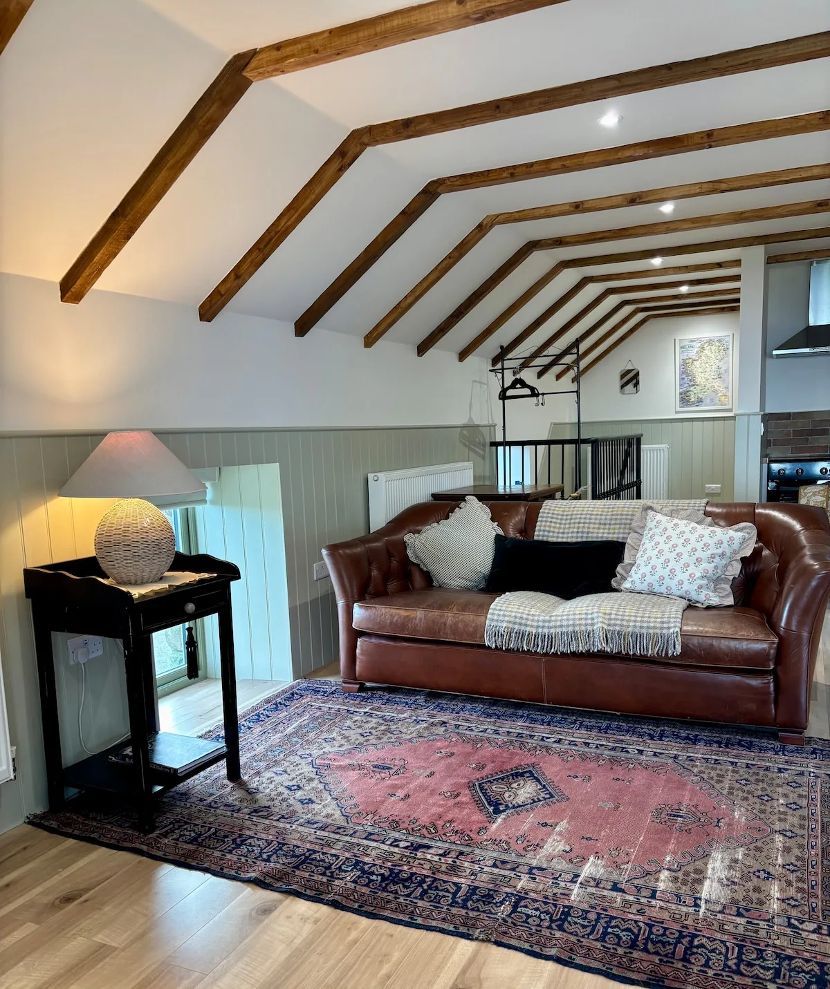Leather sofa and Persian rug in the cosy sitting area