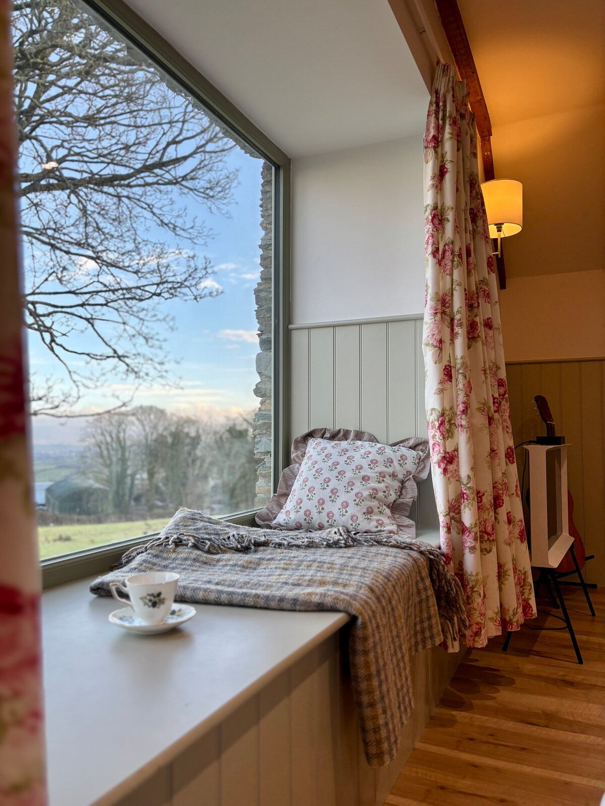 Window seat with countryside views and a cup of tea
